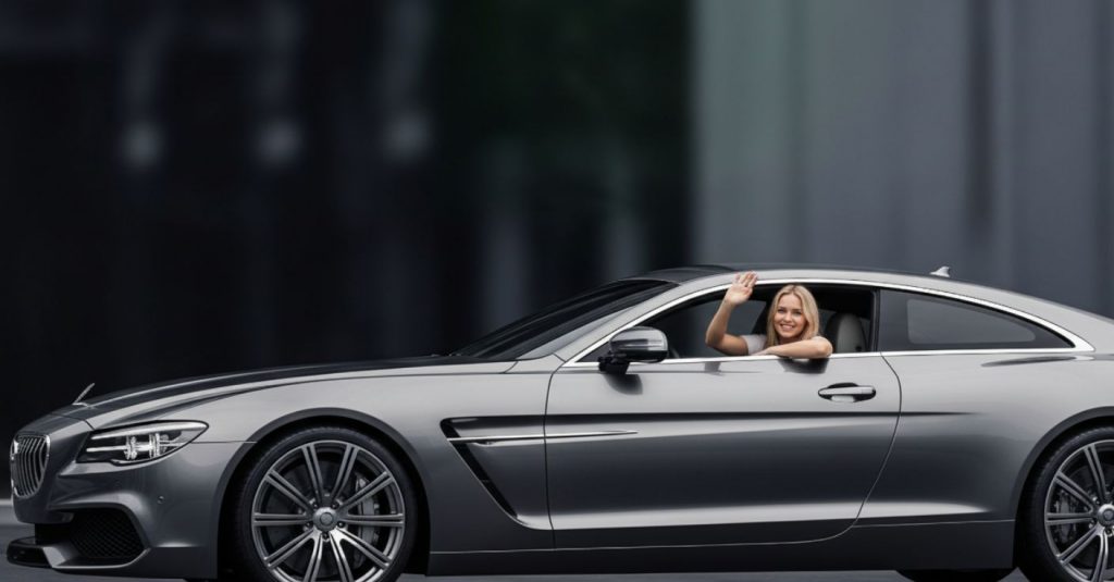 A smiling blonde driver in a sleek, gray luxury car is waving out the window at the camera.